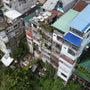 Tall Concrete River Slums Town