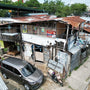 Wooden Slum House with Corrugated Roof